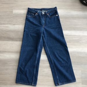 Monki Mozik cropped wide leg organic cotton jeans in rinse blue.